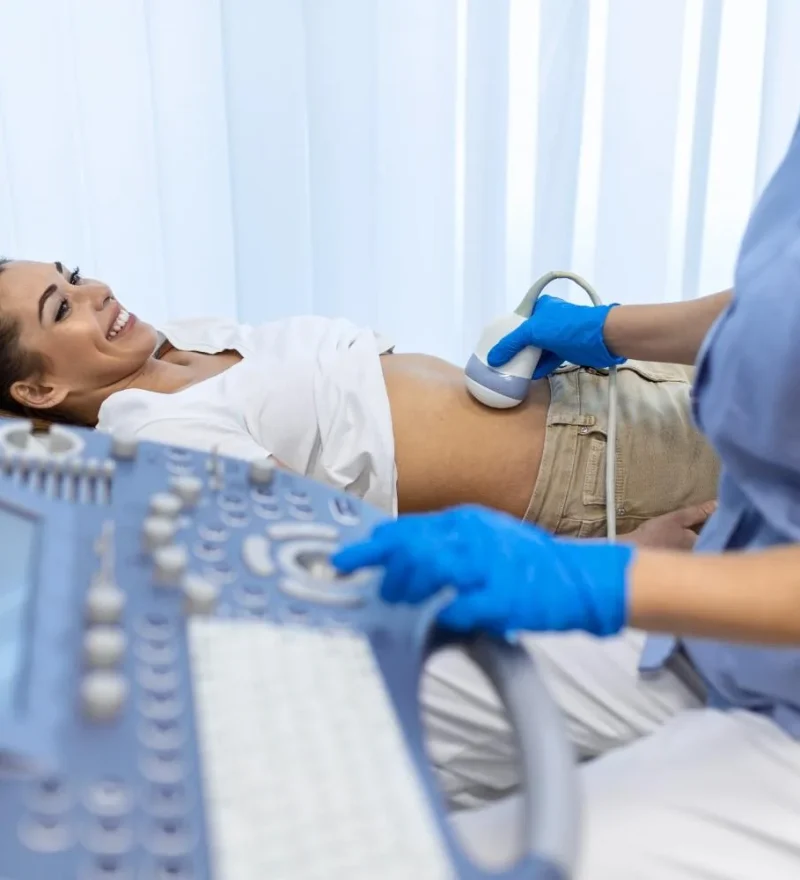 ultrasound-diagnostic-stomach-abdominal-woman-clinic-closeup-view-doctor-runs-ultrasound-sensor-patient-s-girl-tummy-looks-image-screen-diagnosis-internal-organs